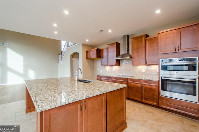 8555 Scenic Ridge Way, Ball Ground, GA 30107 - kitchen featuring wall chimney exhaust hood, stainless steel double oven, black electric stovetop, light tile patterned floors, and light stone countertops