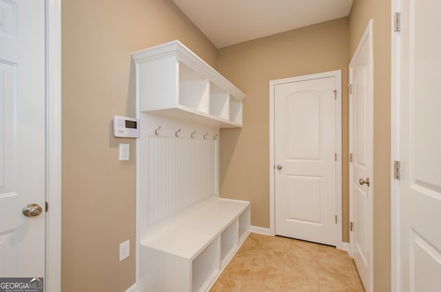 8555 Scenic Ridge Way, Ball Ground, GA 30107 - mudroom featuring light tile patterned flooring and baseboards