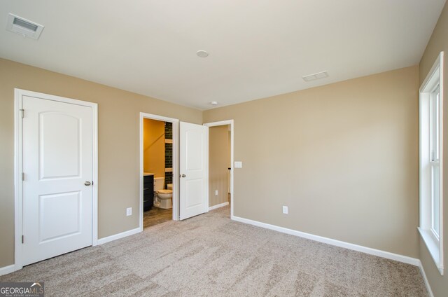 8555 Scenic Ridge Way, Ball Ground, GA 30107 - unfurnished bedroom featuring baseboards and carpet flooring