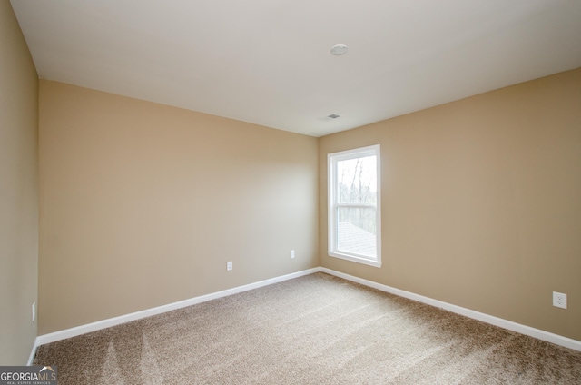 8555 Scenic Ridge Way, Ball Ground, GA 30107 - spare room featuring carpet and baseboards