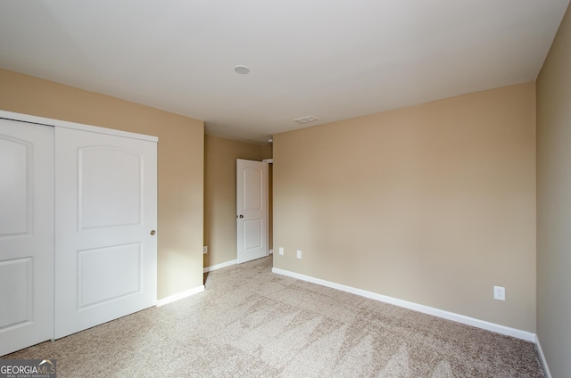8555 Scenic Ridge Way, Ball Ground, GA 30107 - unfurnished bedroom featuring carpet and a closet