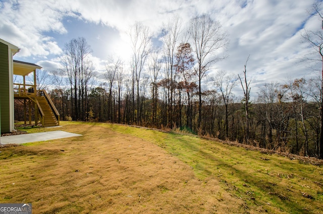 8555 Scenic Ridge Way, Ball Ground, GA 30107 - view of green lawn with stairs and a view of trees