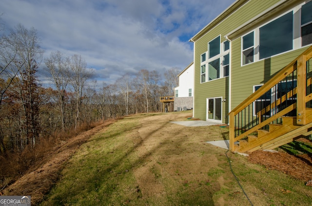 8555 Scenic Ridge Way, Ball Ground, GA 30107 - view of green lawn with a patio and stairway