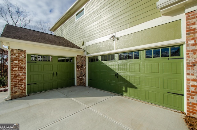 8555 Scenic Ridge Way, Ball Ground, GA 30107 - garage featuring driveway