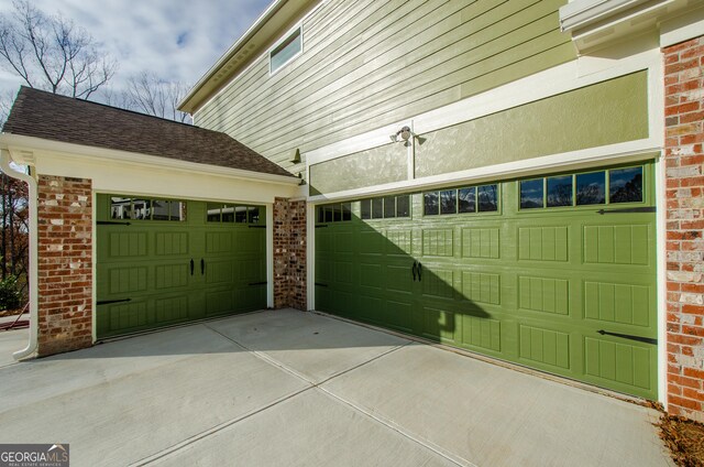 8555 Scenic Ridge Way, Ball Ground, GA 30107 - garage featuring driveway
