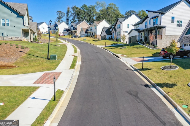 8555 Scenic Ridge Way, Ball Ground, GA 30107 - view of asphalt road featuring a residential view, curbs, street lights, and sidewalks