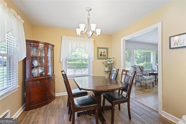 184 Rambo Pl SW, Marietta, GA 30064 - dining room with a chandelier, plenty of natural light, baseboards, and wood finished floors