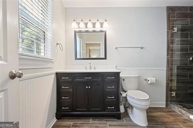 184 Rambo Pl SW, Marietta, GA 30064 - full bathroom with wainscoting, vanity, a stall shower, toilet, and wood tiled floors