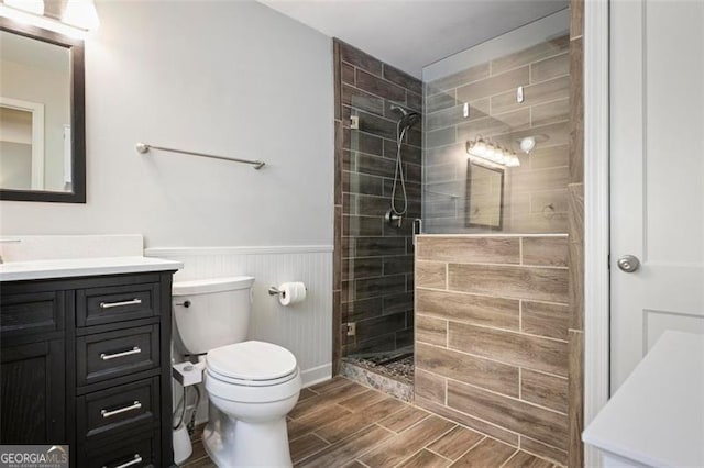 184 Rambo Pl SW, Marietta, GA 30064 - full bath featuring vanity, toilet, a stall shower, wood tiled floors, and wainscoting