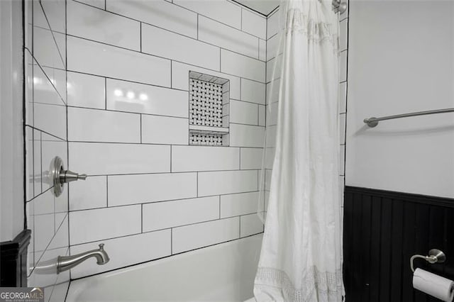 184 Rambo Pl SW, Marietta, GA 30064 - bathroom with shower / bath combo and a wainscoted wall