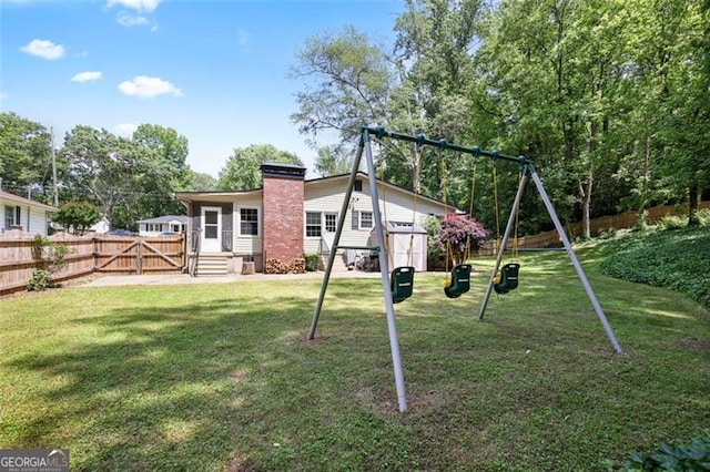184 Rambo Pl SW, Marietta, GA 30064 - back of house with a playground and a chimney