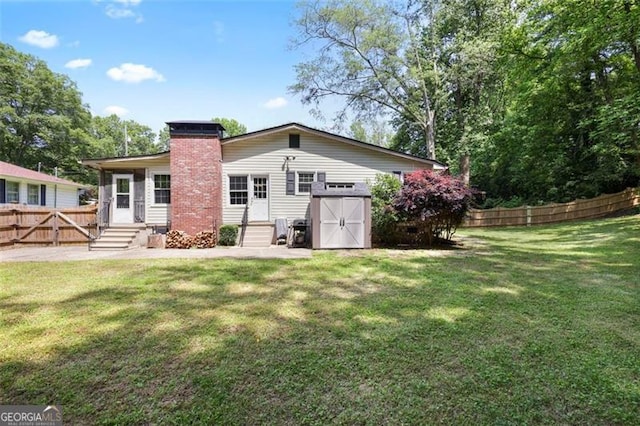 184 Rambo Pl SW, Marietta, GA 30064 - rear view of property with entry steps and a chimney