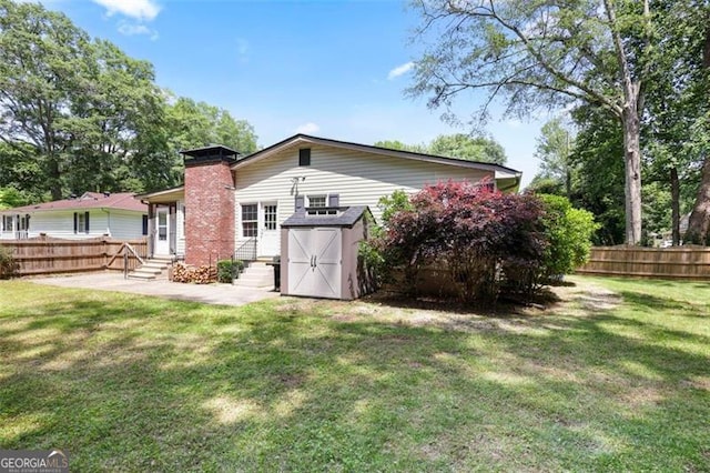 184 Rambo Pl SW, Marietta, GA 30064 - rear view of house featuring entry steps, a patio, and a chimney