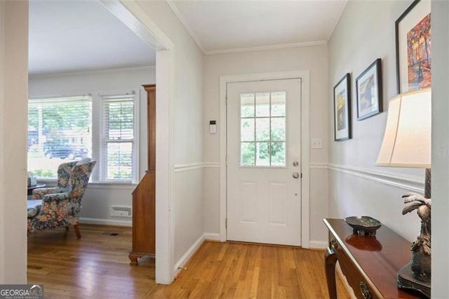 184 Rambo Pl SW, Marietta, GA 30064 - doorway to outside with light wood-style flooring, crown molding, and baseboards