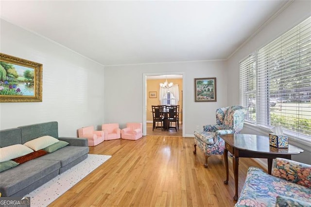 184 Rambo Pl SW, Marietta, GA 30064 - living area featuring a chandelier, light wood-style flooring, and ornamental molding