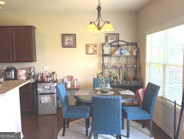 7613 Mockernut Way, Midland, GA 31820 - dining room featuring plenty of natural light, a chandelier, and dark wood-style flooring