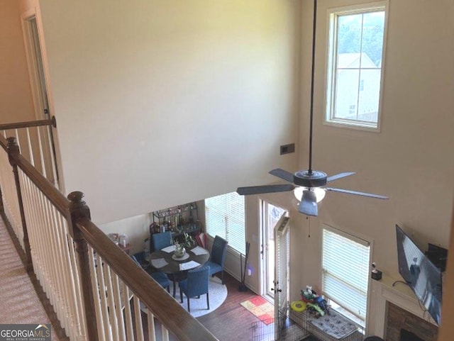 7613 Mockernut Way, Midland, GA 31820 - living area featuring ceiling fan, wood finished floors, and a high ceiling