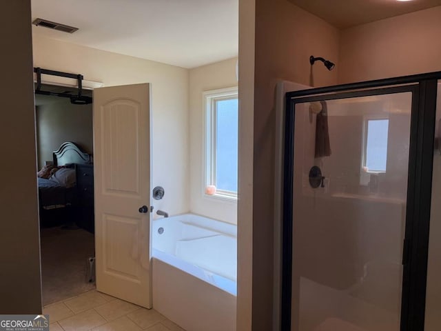 7613 Mockernut Way, Midland, GA 31820 - ensuite bathroom with a shower stall, tile patterned floors, and a garden tub