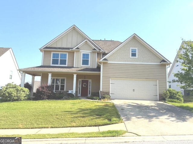7613 Mockernut Way, Midland, GA 31820 - craftsman house with driveway, board and batten siding, a front lawn, stone siding, and covered porch