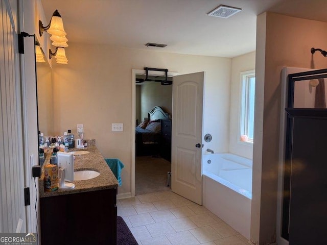 7613 Mockernut Way, Midland, GA 31820 - full bathroom with ensuite bathroom, a bath, double vanity, and tile patterned flooring