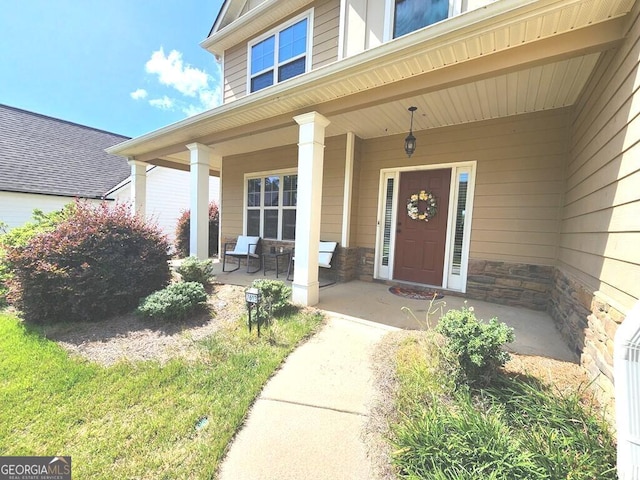 7613 Mockernut Way, Midland, GA 31820 - view of exterior entry featuring a porch and stone siding