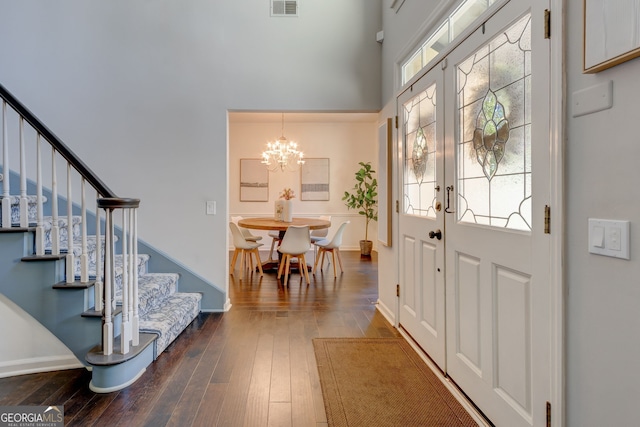 2366 Battle Forest Dr SW, Marietta, GA 30064 - entrance foyer with a high ceiling, stairs, a chandelier, and dark wood-type flooring