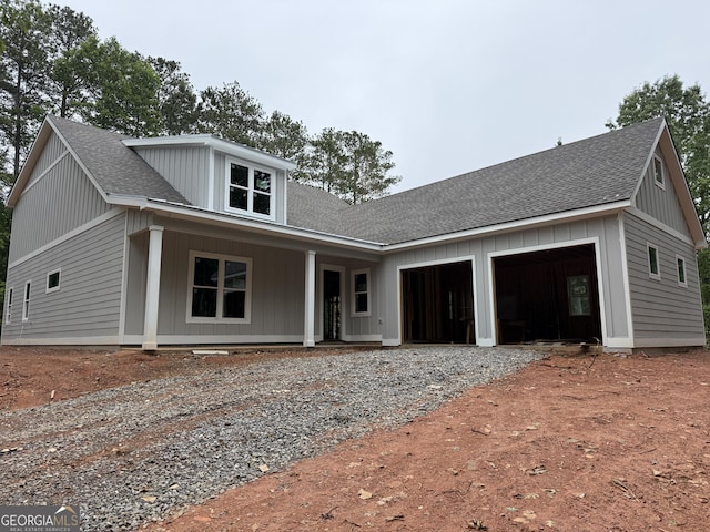 2135 Salem Church Rd, Jasper, GA 30143 - modern farmhouse style home with dirt driveway, a garage, roof with shingles, and covered porch