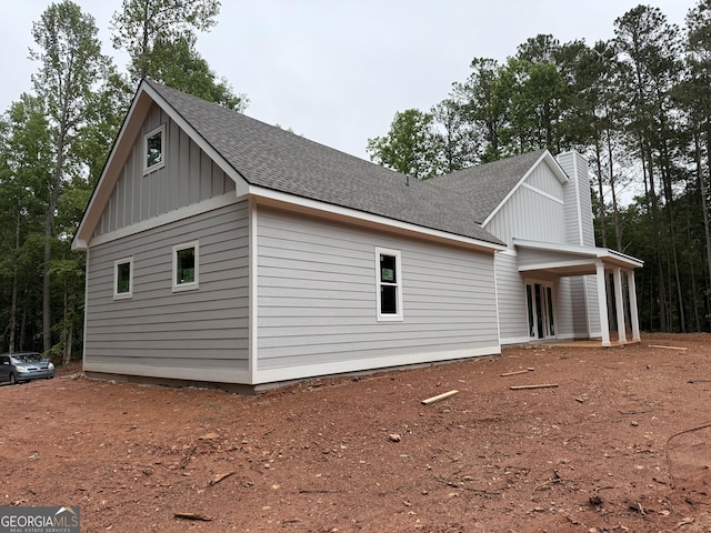 2135 Salem Church Rd, Jasper, GA 30143 - view of property exterior with board and batten siding, a shingled roof, and a chimney