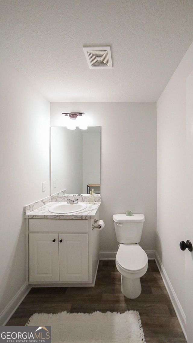 170 Kinsley Way, Statham, GA 30666 - bathroom featuring wood finished floors, vanity, and a textured ceiling
