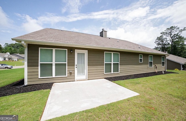170 Kinsley Way, Statham, GA 30666 - back of property with a patio, a chimney, and a yard