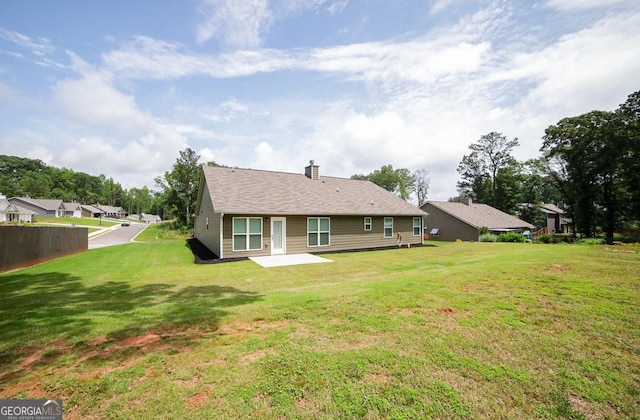 170 Kinsley Way, Statham, GA 30666 - back of property featuring a lawn and a chimney