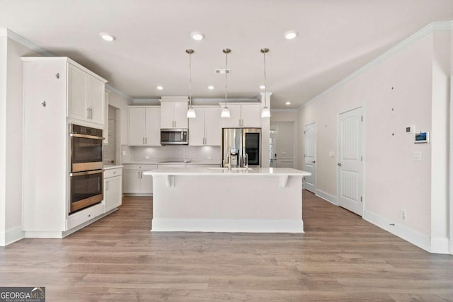 724 Broken Arrow, Waleska, GA 30183 - kitchen with appliances with stainless steel finishes, white cabinetry, light countertops, decorative backsplash, and a kitchen island with sink