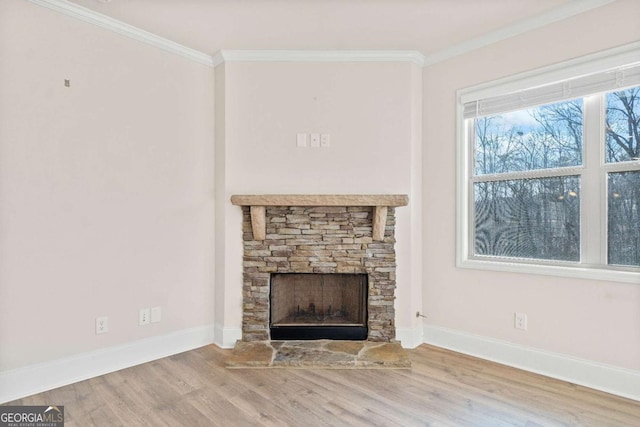 724 Broken Arrow, Waleska, GA 30183 - unfurnished living room featuring baseboards, crown molding, wood finished floors, and a stone fireplace