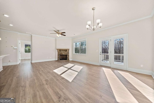 724 Broken Arrow, Waleska, GA 30183 - unfurnished living room featuring a fireplace, ornamental molding, a chandelier, baseboards, and a ceiling fan