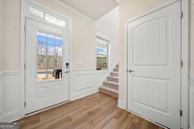 724 Broken Arrow, Waleska, GA 30183 - entrance foyer with crown molding, a wainscoted wall, stairway, and wood finished floors