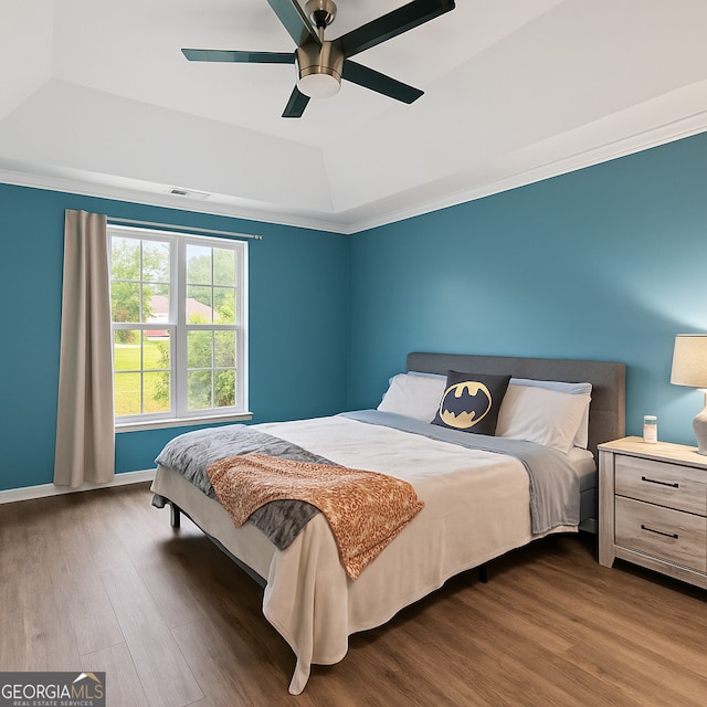 106 Kerby Cir, Braselton, GA 30517 - bedroom with a raised ceiling, dark wood-style floors, a ceiling fan, baseboards, and crown molding