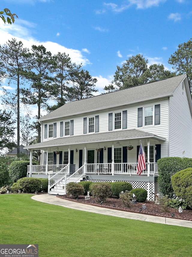 21 Picketts Rdg, Acworth, GA 30101 - view of front facade featuring a porch, a front yard, and a shingled roof