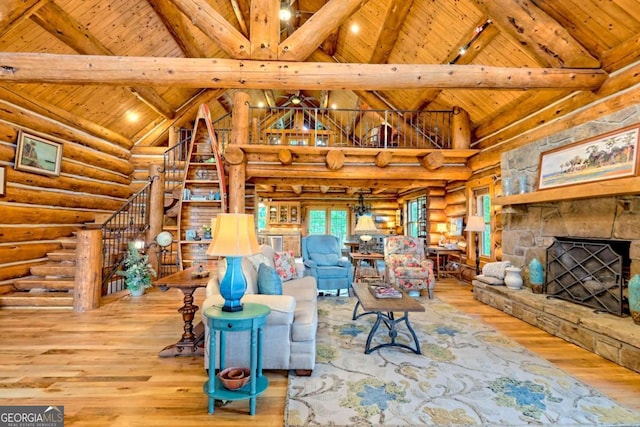 6487 W Old Highway 64 W, Warne, NC 28909 - living area featuring rustic walls, wood ceiling with exposed beams, hardwood / wood-style floors, stairs, and high vaulted ceiling