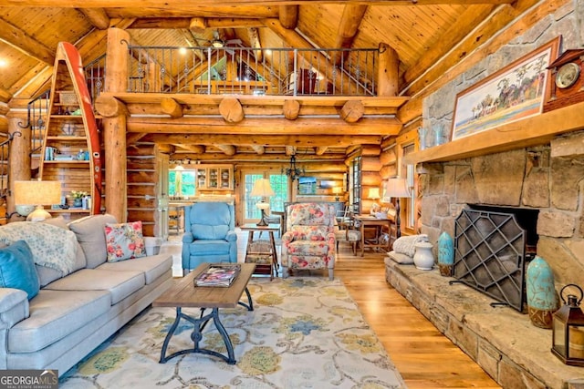 6487 W Old Highway 64 W, Warne, NC 28909 - living area with rustic walls, wood ceiling with exposed beams, wood finished floors, high vaulted ceiling, and a fireplace