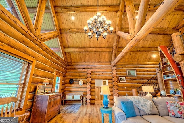6487 W Old Highway 64 W, Warne, NC 28909 - living room featuring wooden ceiling with exposed beams, hardwood / wood-style flooring, a chandelier, healthy amount of natural light, and rustic walls