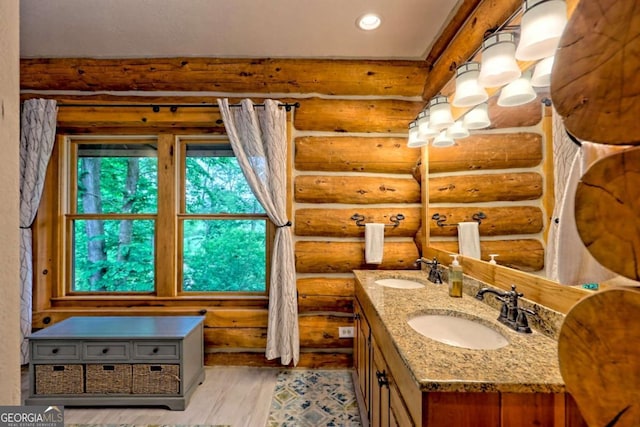 6487 W Old Highway 64 W, Warne, NC 28909 - bathroom featuring log walls, wood finished floors, double vanity, and recessed lighting