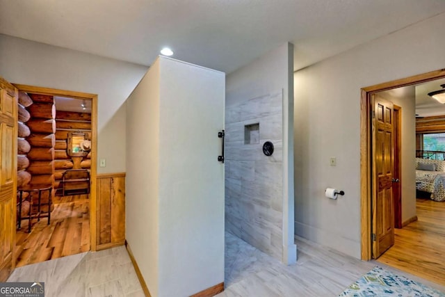 6487 W Old Highway 64 W, Warne, NC 28909 - hall with rustic walls, light wood finished floors, wainscoting, and baseboards