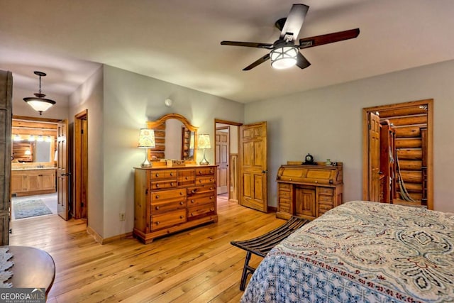 6487 W Old Highway 64 W, Warne, NC 28909 - bedroom featuring light wood-style flooring, baseboards, a ceiling fan, and ensuite bath