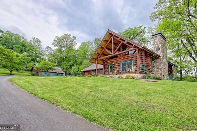 6487 W Old Highway 64 W, Warne, NC 28909 - log cabin featuring a front lawn, log exterior, and a chimney