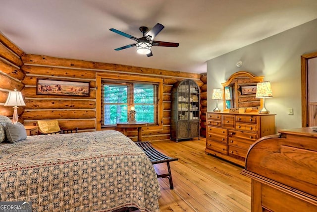6487 W Old Highway 64 W, Warne, NC 28909 - bedroom with rustic walls and wood-type flooring