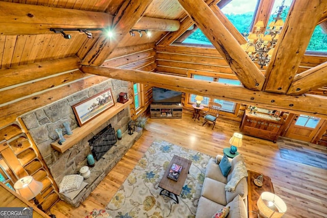 6487 W Old Highway 64 W, Warne, NC 28909 - living area featuring wood ceiling, log walls, wood-type flooring, and a fireplace