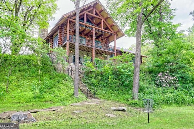 6487 W Old Highway 64 W, Warne, NC 28909 - back of property with log exterior, stairway, and a chimney