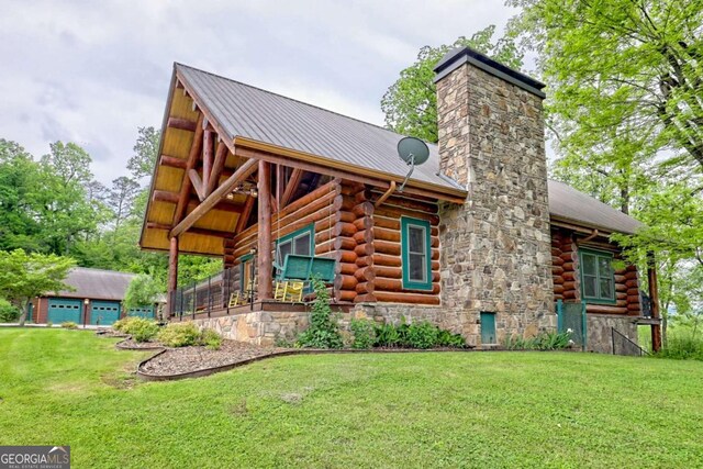 6487 W Old Highway 64 W, Warne, NC 28909 - back of property with log siding, stone siding, a chimney, and a yard