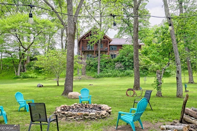 6487 W Old Highway 64 W, Warne, NC 28909 - view of grassy yard featuring an outdoor fire pit