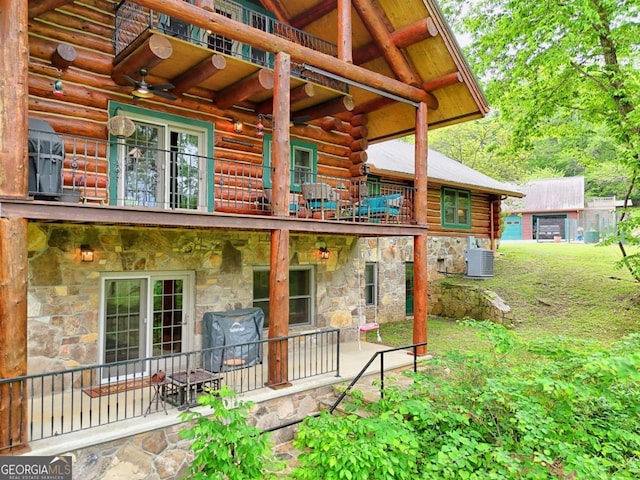 6487 W Old Highway 64 W, Warne, NC 28909 - doorway to property with a balcony, log exterior, stone siding, central AC unit, and a patio